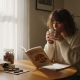 Woman reading about mushroom edibles at kitchen table