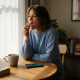 Woman taking mushroom gummy in sunlight