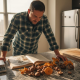 Man inspecting mushrooms at kitchen counter