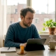 Canadian man researching psilocybin at kitchen table
