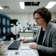 Scientist reviewing brain scans in research lab