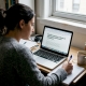 Woman researches psilocybin interactions at home desk