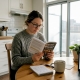 Woman reading guide to magic mushrooms in Canada