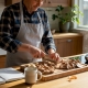 Home chef preparing mushrooms in kitchen