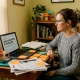 Woman studying psilocybin research at home desk