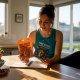 Woman compares gummies and chocolates at kitchen table