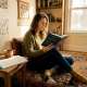 Woman reading about psychedelic blends at home